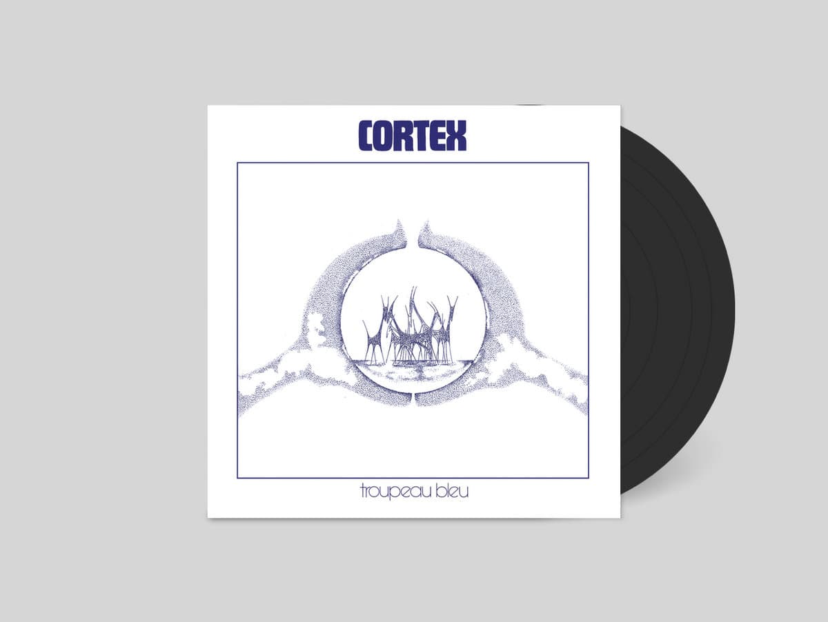 Vinyl record with a white cover featuring 'Cortex' and 'Toupeau Bleu' on a gray background