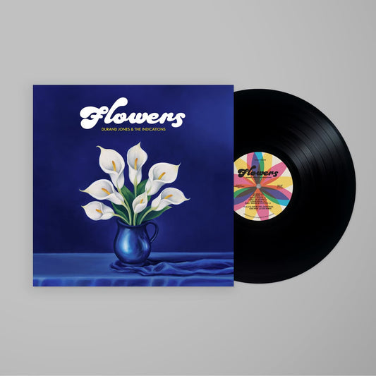 Vinyl record with cover featuring a floral design and 'Flowers' text on a gray background