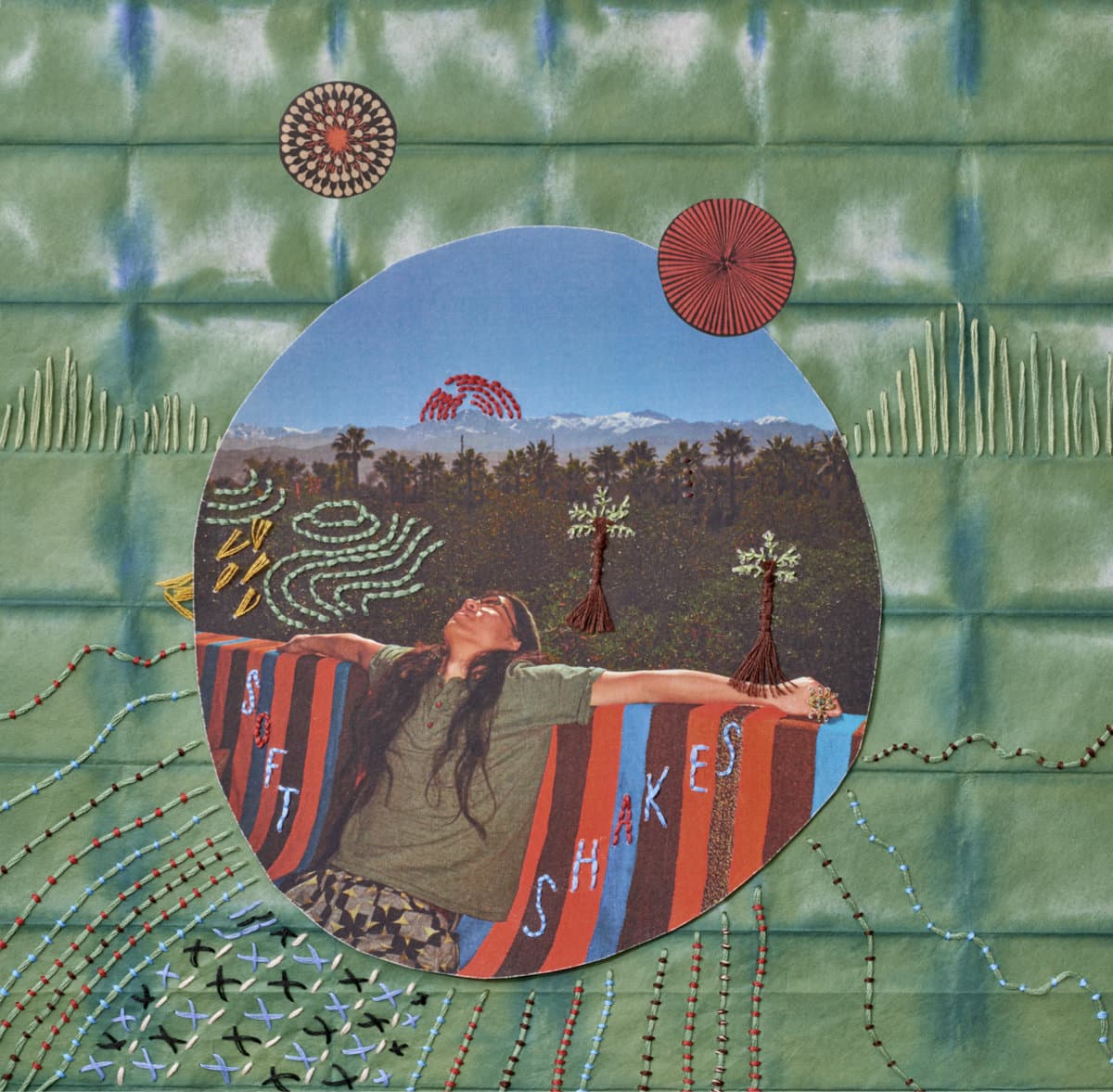 Cover art for Go Kurosawa - soft shakes, featuring an artistic depiction of a person lying on a colorful blanket with nature elements and text.