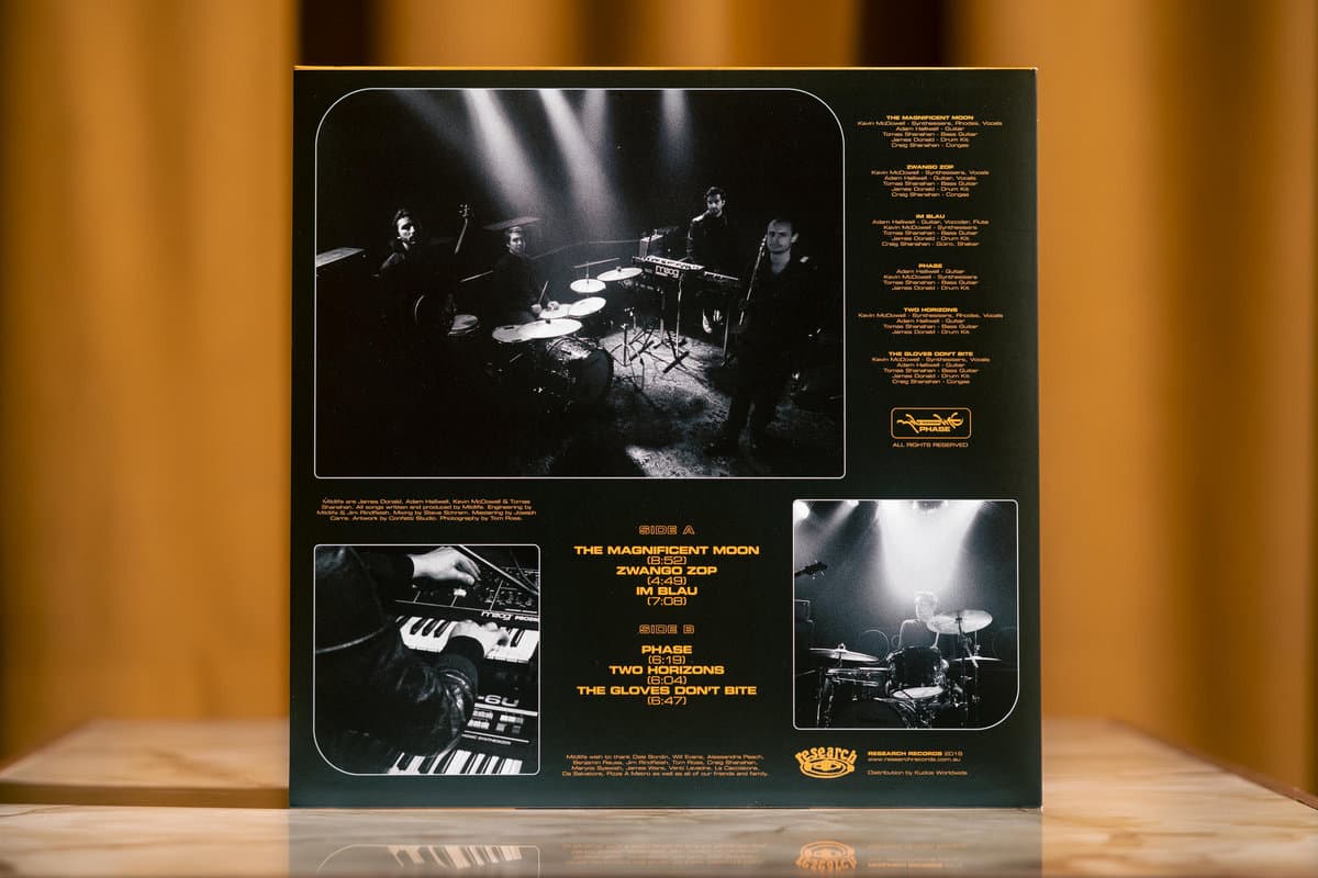 Cover of Mildlife's Phase LP on black vinyl—psychedelic jazz-funk fusion from Melbourne, packed with cosmic grooves, dreamy synths, and hypnotic rhythms.