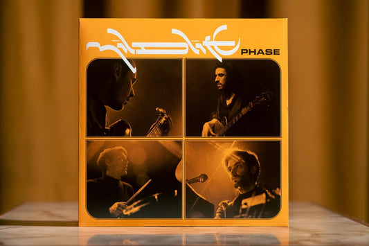 Cover of Mildlife's Phase LP on black vinyl—psychedelic jazz-funk fusion from Melbourne, packed with cosmic grooves, dreamy synths, and hypnotic rhythms.