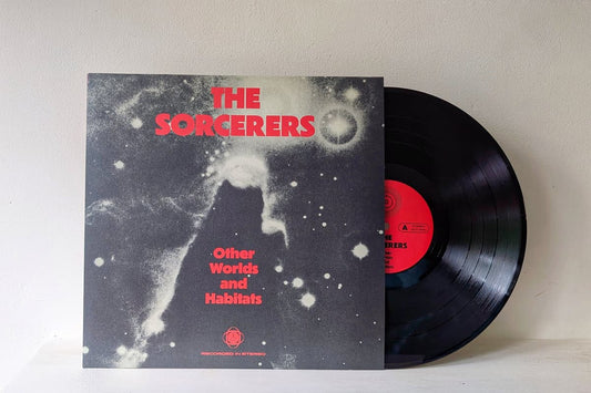 Vinyl record with cover titled 'The Sorcerers: Other Worlds and Habitats' on a light gray background