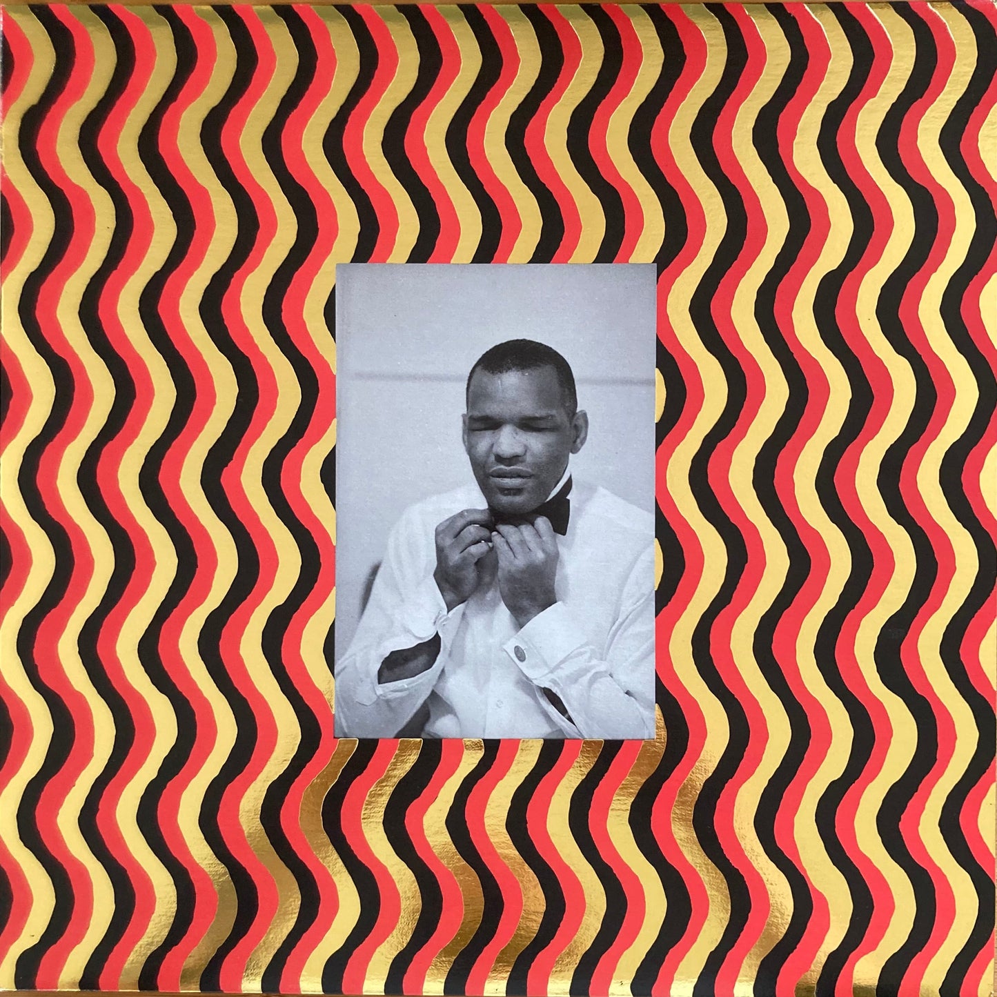 Front cover of “The World Is a Cafeteria” 2LP soul compilation by Cairo Records. Gold foil detail, white sleeves, deluxe packaging with booklet.