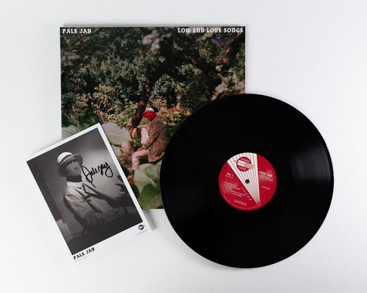 Vinyl, cover art and a signed photo of Pale Jay against a white background