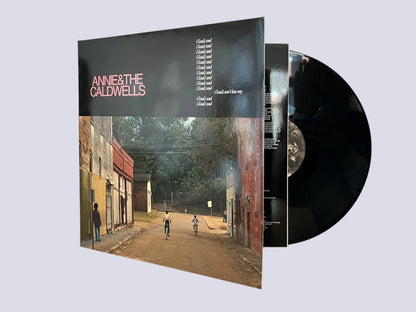 Vinyl record with cover featuring an urban scene and 'Annie & The Caldwell' text.