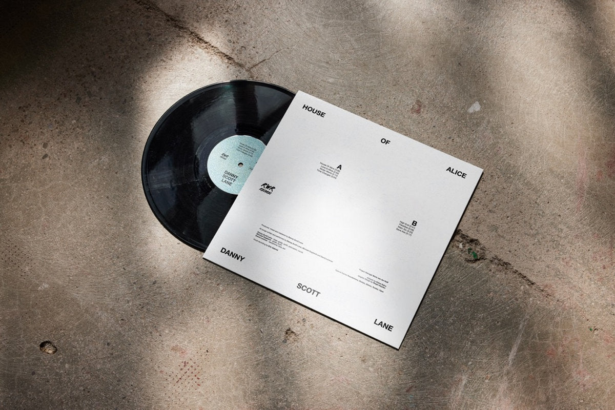 Vinyl record and its cover on a textured surface