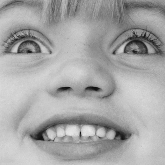 Cover art for Georgie Sweet - I Swear To You, featuring a black and white photo close-up of a child's face with wide eyes and a smile.