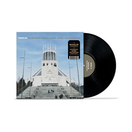 Vinyl record with a cover featuring a building and text