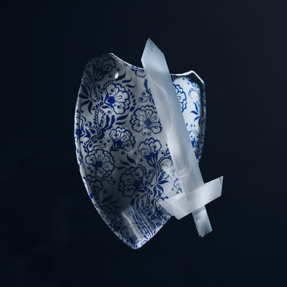 Cover art for "Porcelain Shield, Paper Sword" by Mary Sue and the Clementi Sound Appreciation Club depicting a blue floral-patterned shield with a white sword on a black background