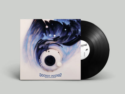 Vinyl record with a cover featuring artistic design on a gray background