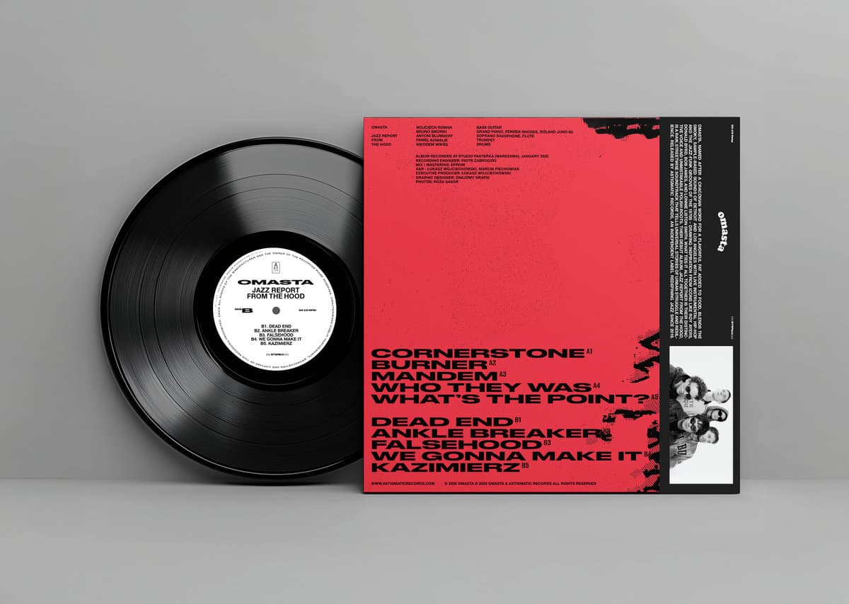 Vinyl record with a red cover on a gray background