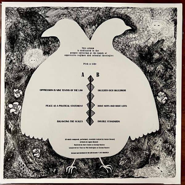 Album cover with a dove silhouette and text on a textured background