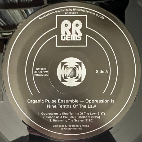 Vinyl record label with 'RR GEMS' branding and tracklist on a black background