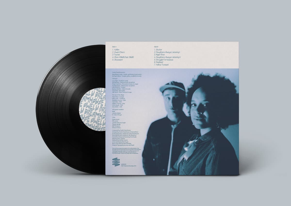 Vinyl record with a cover featuring two people on a gray background