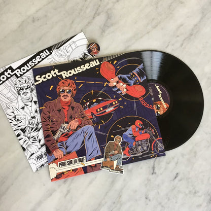 Vinyl record with colorful cover featuring a person on a motorcycle and text, on a marble surface.