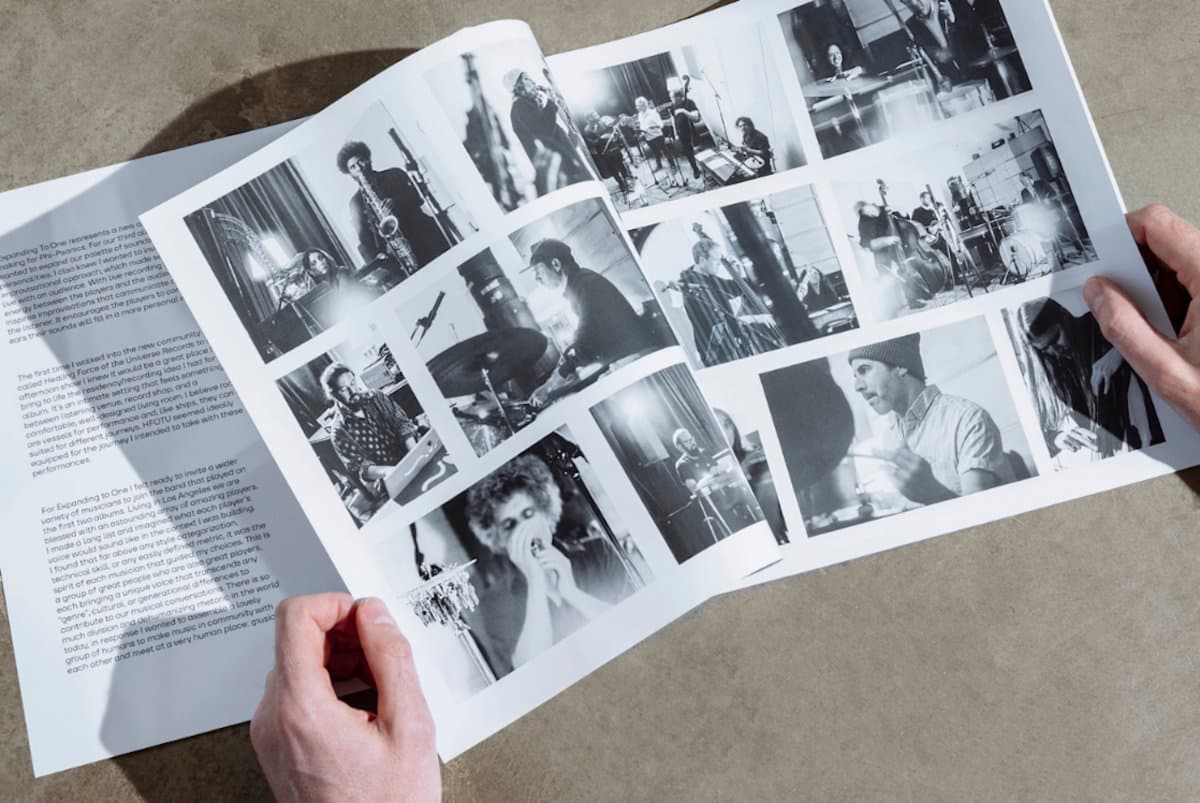 Close up of liner note booklet for Phi-Sonics - Expanding as one, featuring black and white photos of the band members playing their instruments.