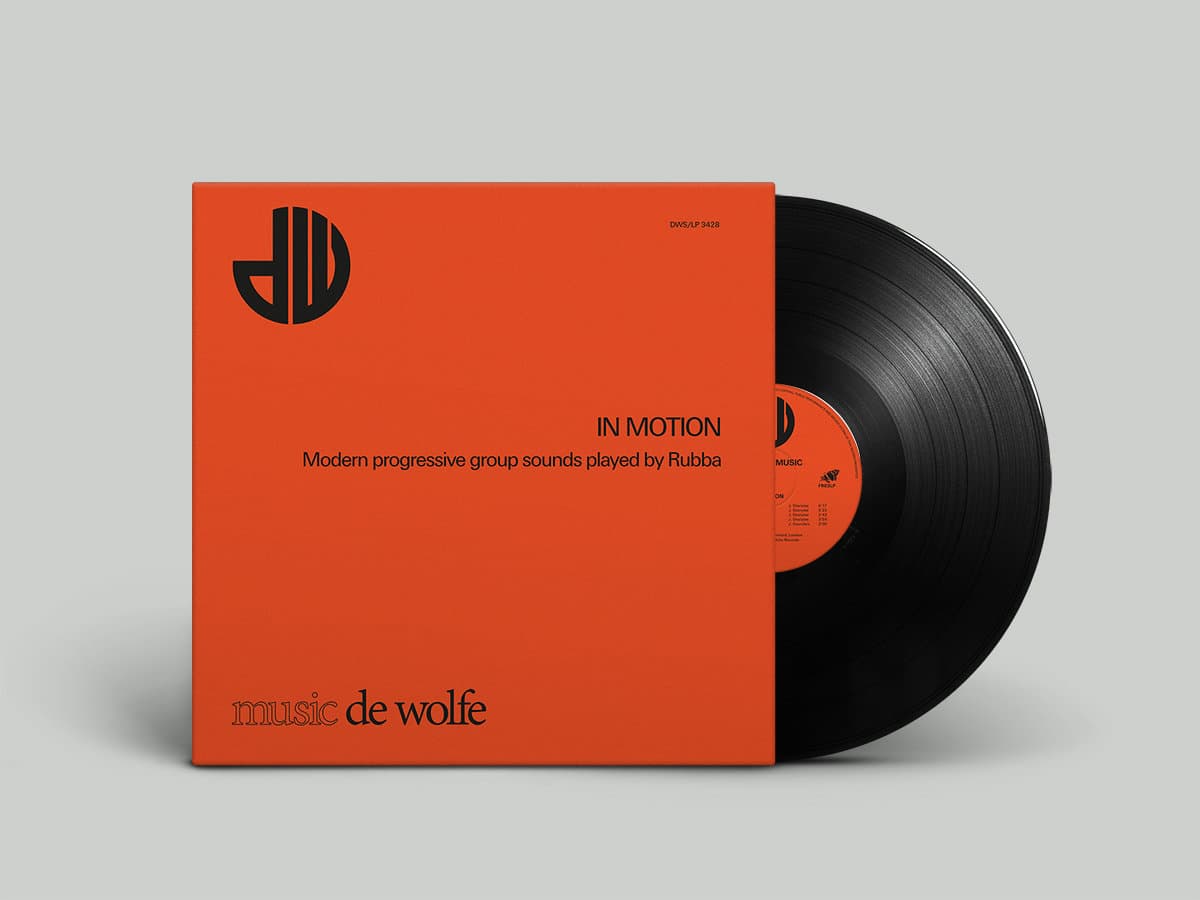 Vinyl record with orange cover and black disc on a gray background