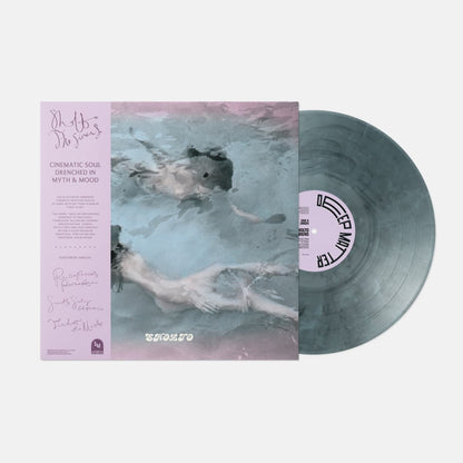 Vinyl record with cover featuring an artistic design of a person underwater.