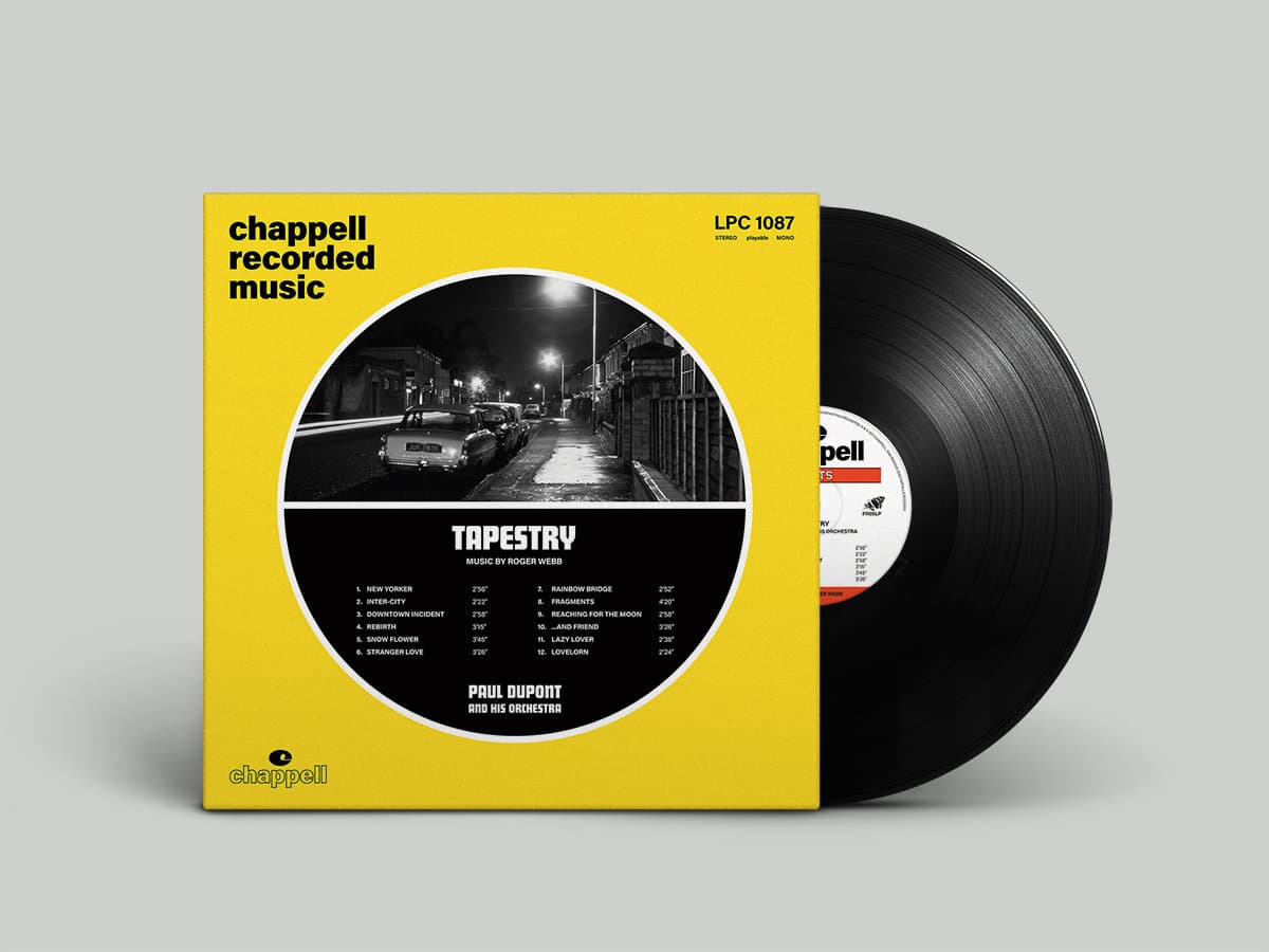 Vinyl record with yellow cover featuring a city street scene and album details.