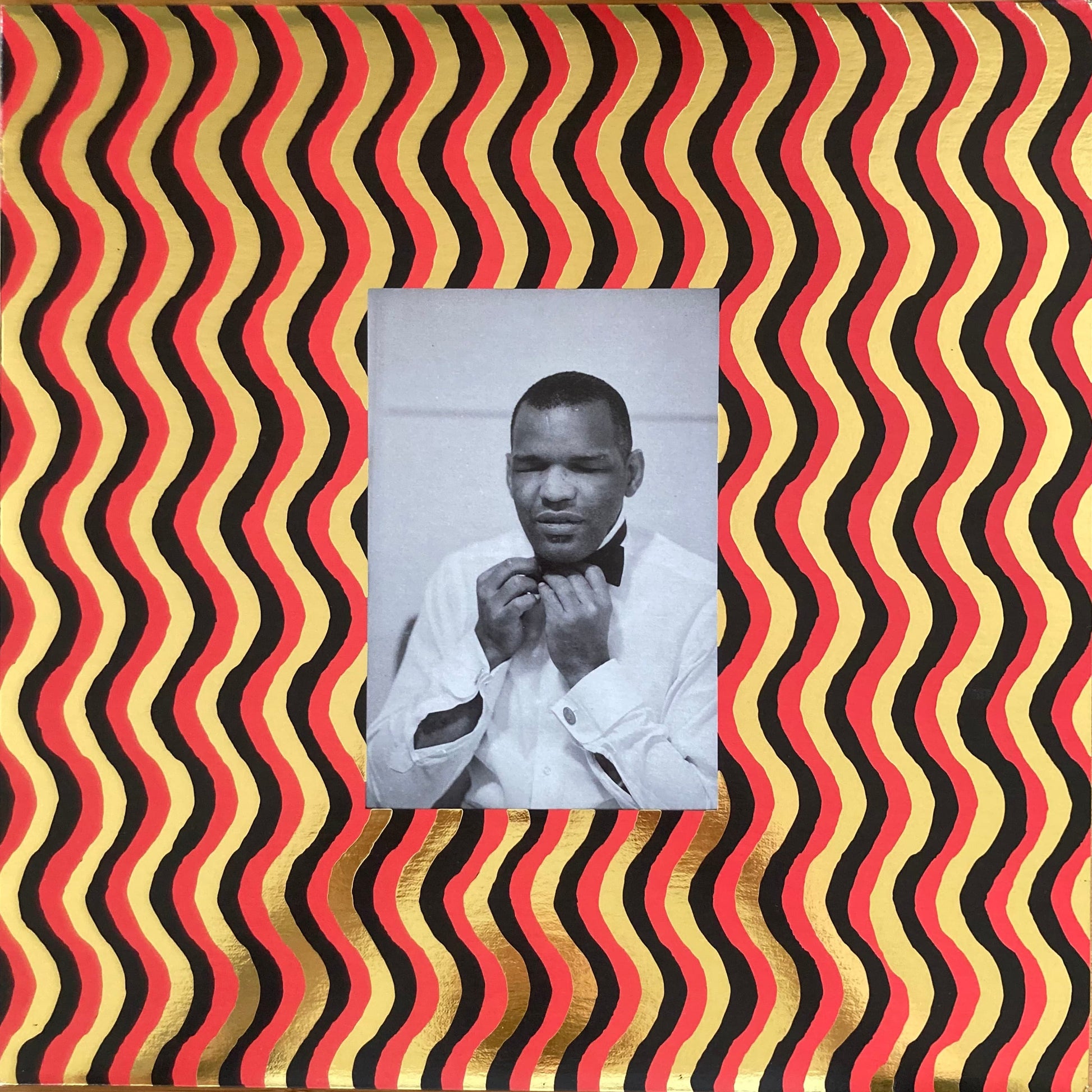 Front cover of “The World Is a Cafeteria” 2LP soul compilation by Cairo Records. Gold foil detail, white sleeves, deluxe packaging with booklet.