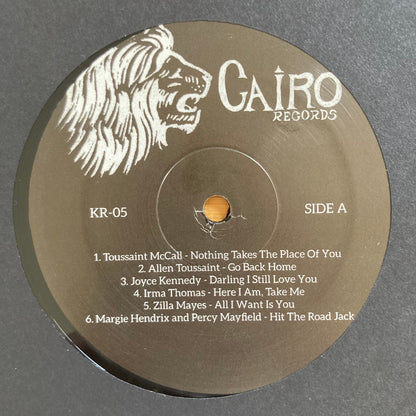 Vinyl label, side A, for “The World Is a Cafeteria” 2LP soul compilation by Cairo Records. Gold foil detail, white sleeves, deluxe packaging with booklet.