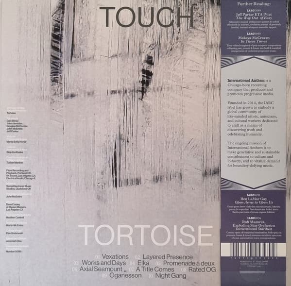 Back cover for Tortoise - Touch, featuring album track list against a black and grey background