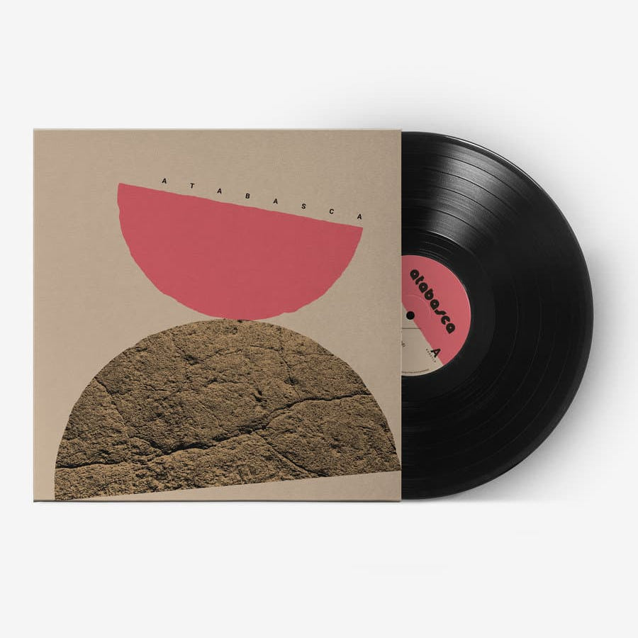 Vinyl record with a unique cover design featuring abstract shapes on a white background