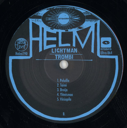 Vinyl record label with 'HELMI' and Lightman - Trombi branding and tracklist on a black background