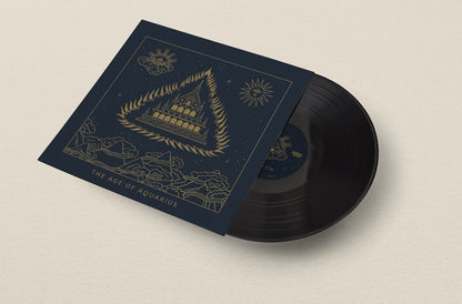 Vinyl record with a blue cover featuring gold illustrations on a beige background