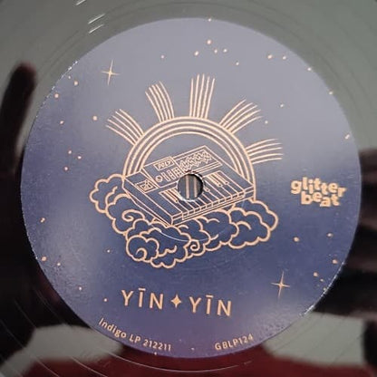 Vinyl record label with 'Yin Yin' lettering and 'glitterbeat' branding.