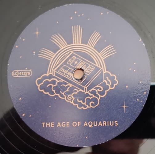 Vinyl record label with 'The Age of Aquarius' design and text.